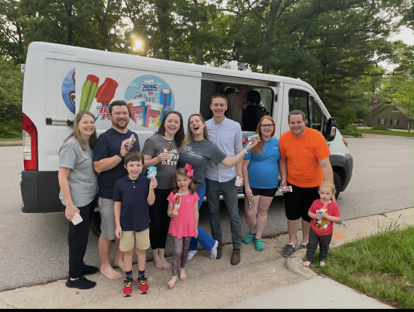 Happy family with ice cream truck
